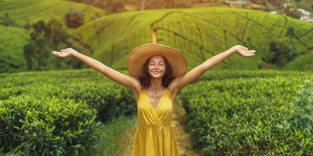 Woman Traveler in Front of Nature Background Tea Plantations Landscape in Sri Lanka