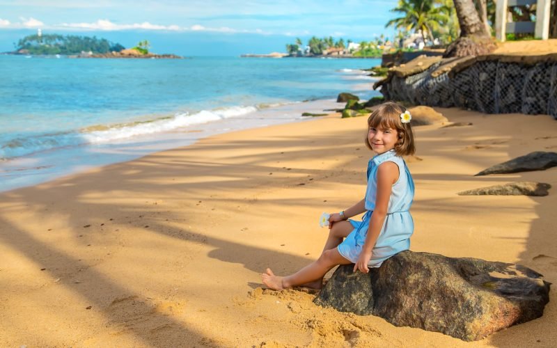 Child girl on the beach in Sri Lanka. Selective focus.
